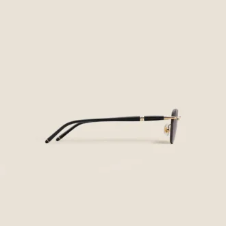 Gafas de sol redondas con montura metálica dorada